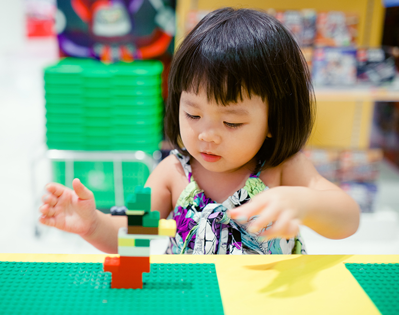 Girl Playing with Blocks